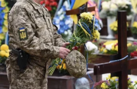 Ukrainian Soldier Holding Flowers X