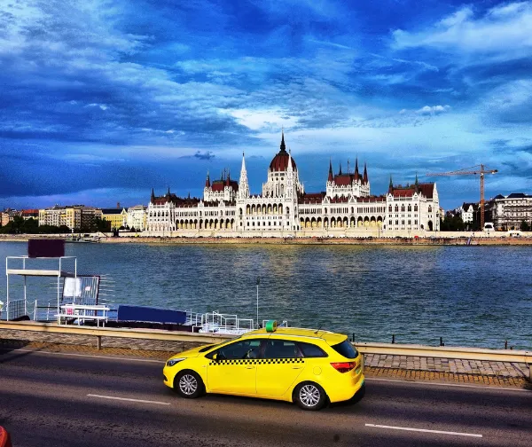 Budapest Taxi In Front Of The Hungarian Parliament