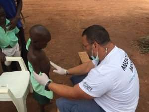 Peter and Hungarian doctors in Kapeke, Uganda