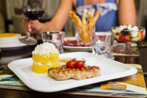 Grilled steak with baked vegetables and fresh rosemary