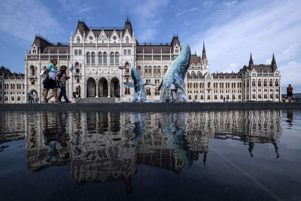 Greenpeace protest plastic pollution with lifesize whales in Budapest