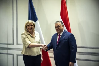 Hungarian Prime Minister Viktor Orbán talks with Marine Le Pen