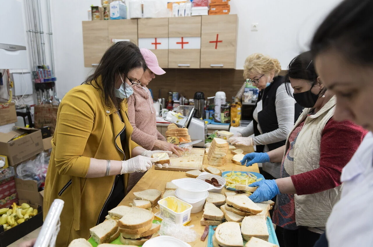 People Making Food for Ukraine Refugees